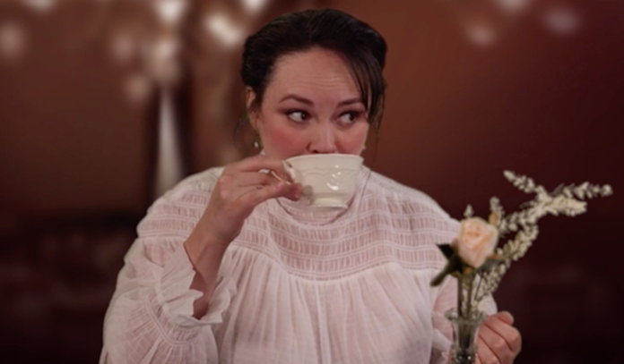 An actress sips on a cup of tea.