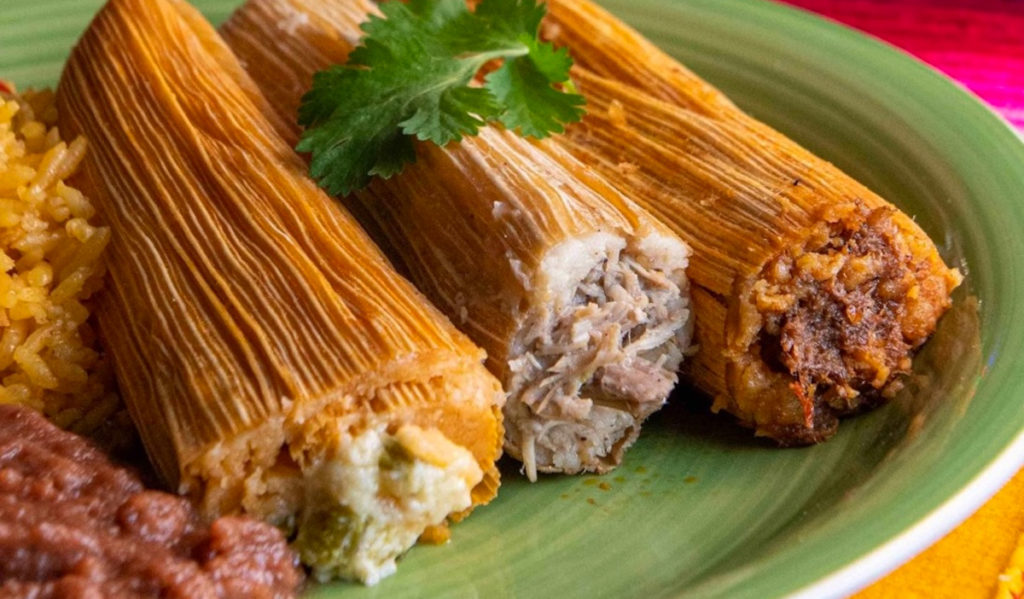 A plate of three different tamales