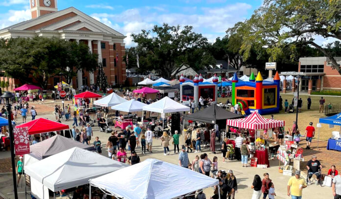 A City Hall square filled with tents and shoppers