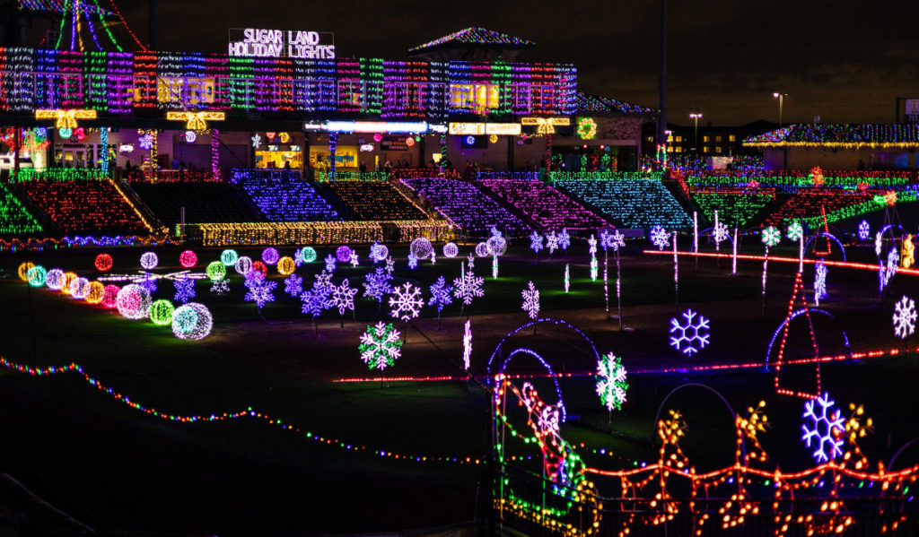 A ballpark decked out in holiday lights and decor