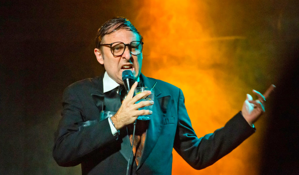 Comedian Neil Hamburger performs on stage