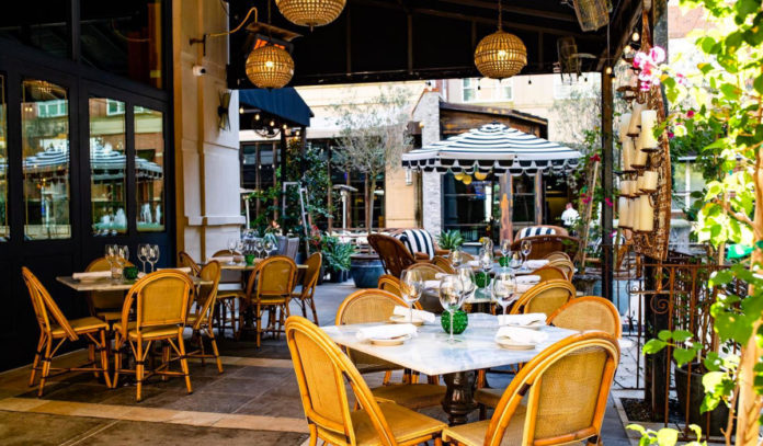 An outdoor patio with dining seating