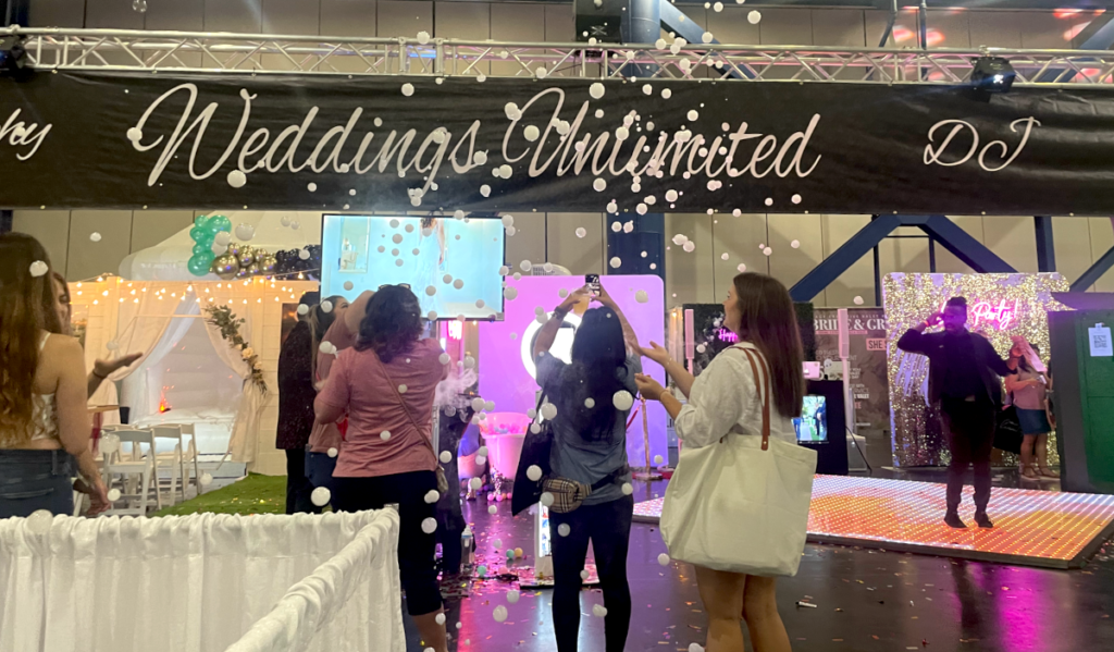 Wedding vendors showcase dance floors and bubble machines for attendees