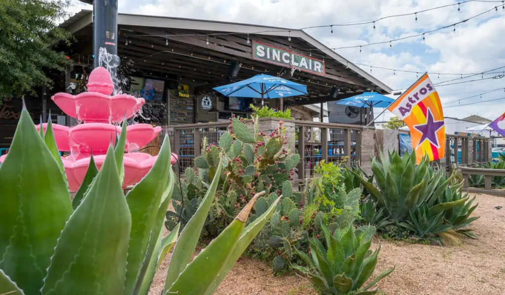 The front exterior of Cactus Cove, with assorted cactus in the foreground