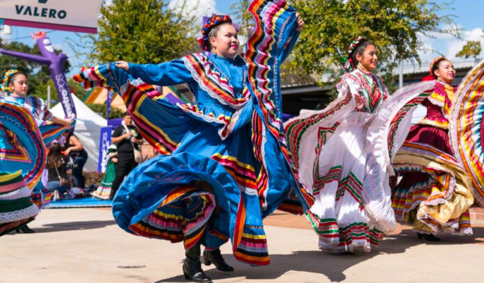 Ballet Folklorico performers twirl colorful dresses