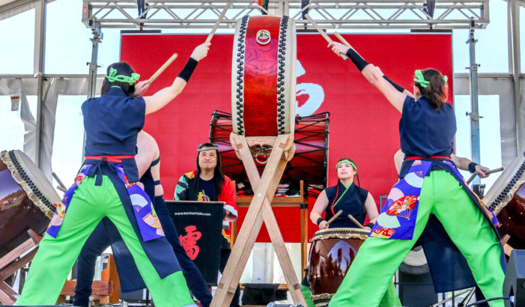 A traditional Japanese drumming performance on a stage