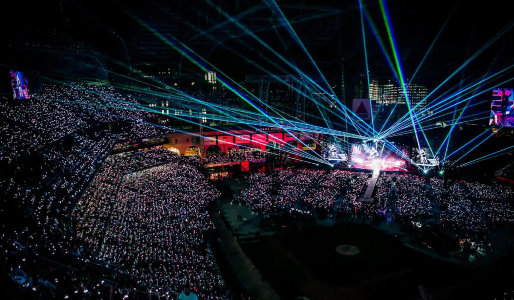 Minute Maid Park in a concert setting with laser lights and rows of seating on the field
