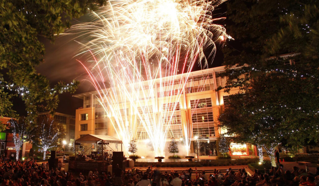 A crowd watches fireworks at CityCentre