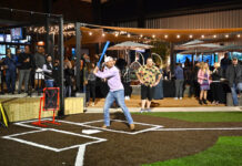 Things to Do in Houston for Father’s Day Weekend 2023 A person in a batting stance ready for a pitch
