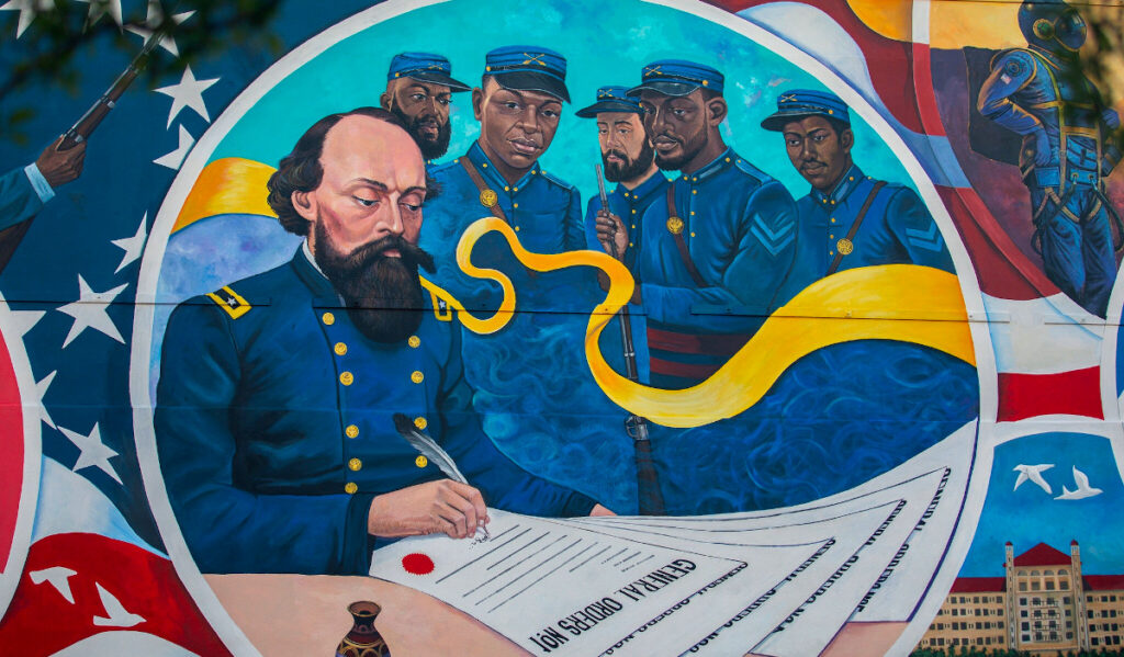 A detail of a wall mural that celebrates the signing of General Order No. 3