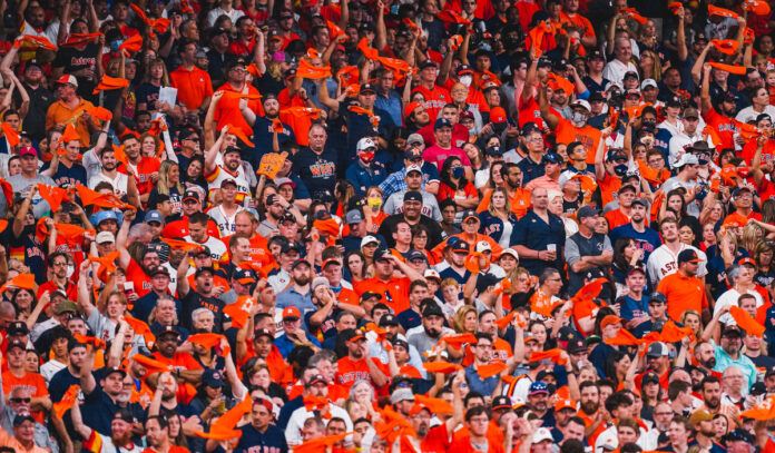 A crowd image featuring dozens of fans in Astros clothing