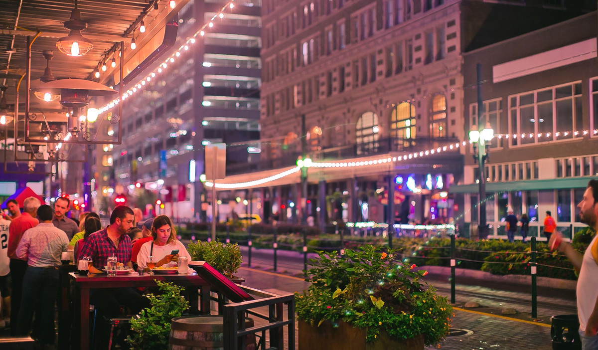 A nighttime scene on patio seating along Main Street in Downtown Houston