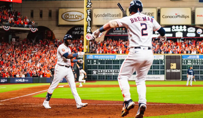 Yordan Alvarez and Alex Bregman celebrate a home run