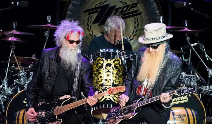 Members of ZZ Top perform on stage