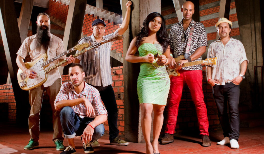 Members of Dengue Fever posing in a promotional photo