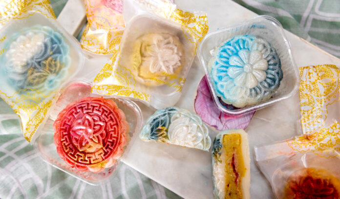 An assortment of colorful mooncakes with intricate patterns