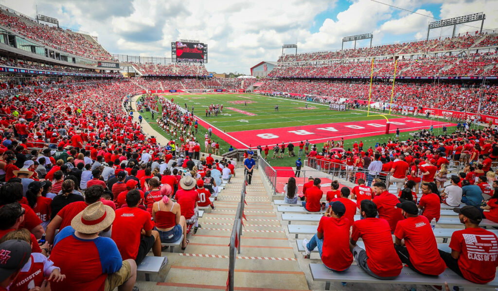 A wide shot of a crowded football stadium