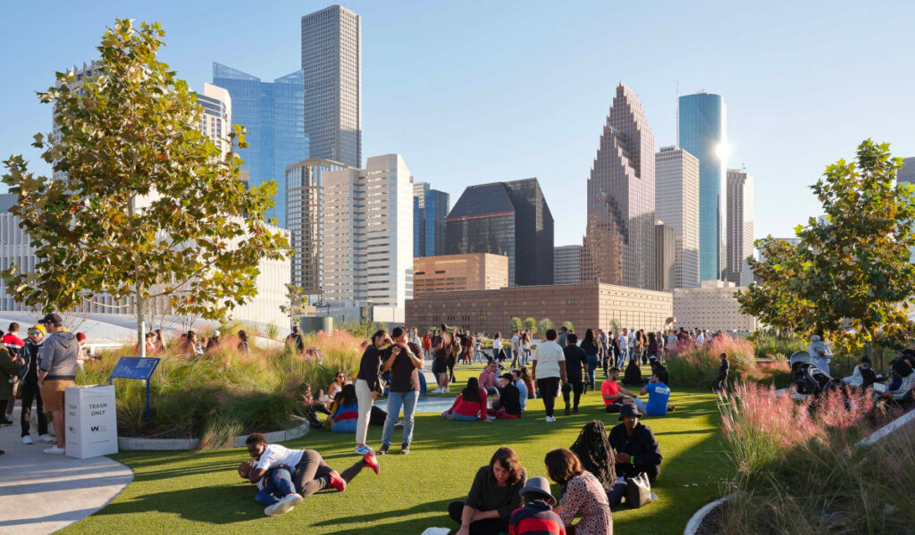 A sunny day on the skylawn at Post Houston with the Downtown skyline in the background