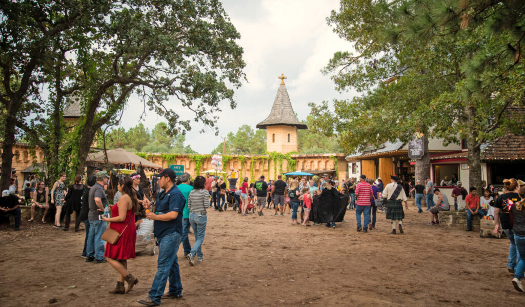 Crowds of people walking through a renaissance fair