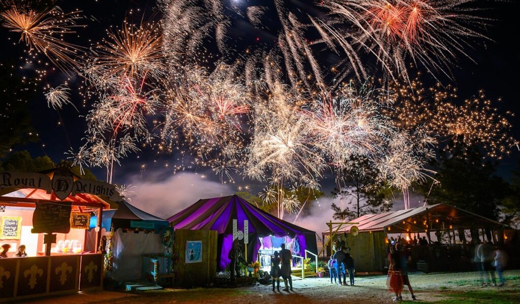 Fireworks go off above a market