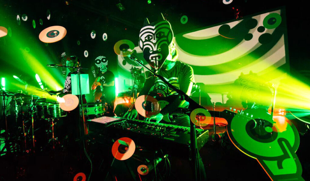 Members of Sonido Gallo Negro performing with masks on