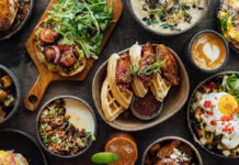 Where to Brunch in the Heights A spread of brunch dishes with chicken and waffles, drinks and more
