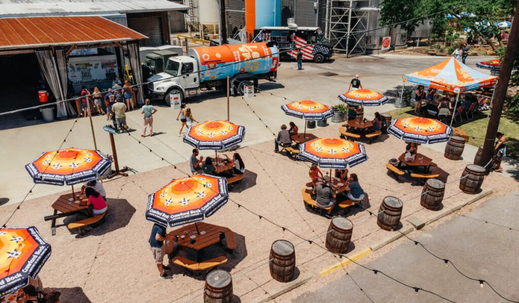 An overhead view of Karbach Brewery with tables spread out