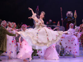 A ballet performer leaps through the air