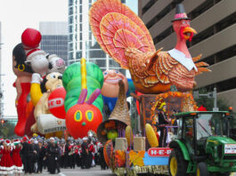 A lineup of floats beginning a parade in Downtown Houston