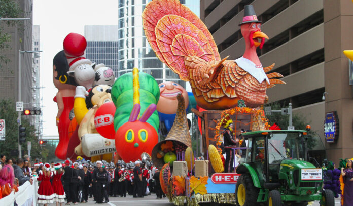 A lineup of floats beginning a parade in Downtown Houston