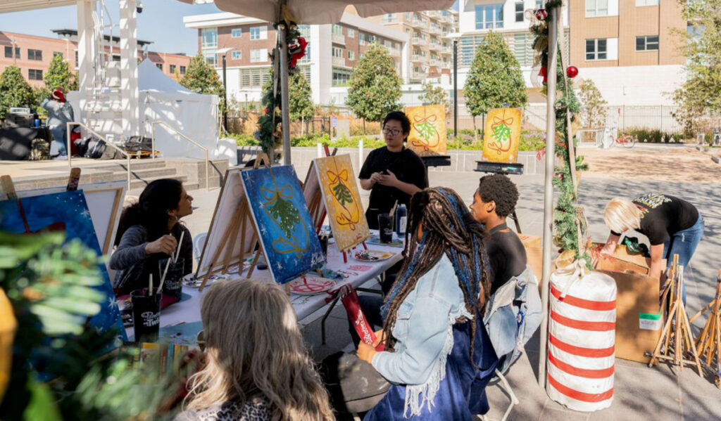 A person leading a class on painting