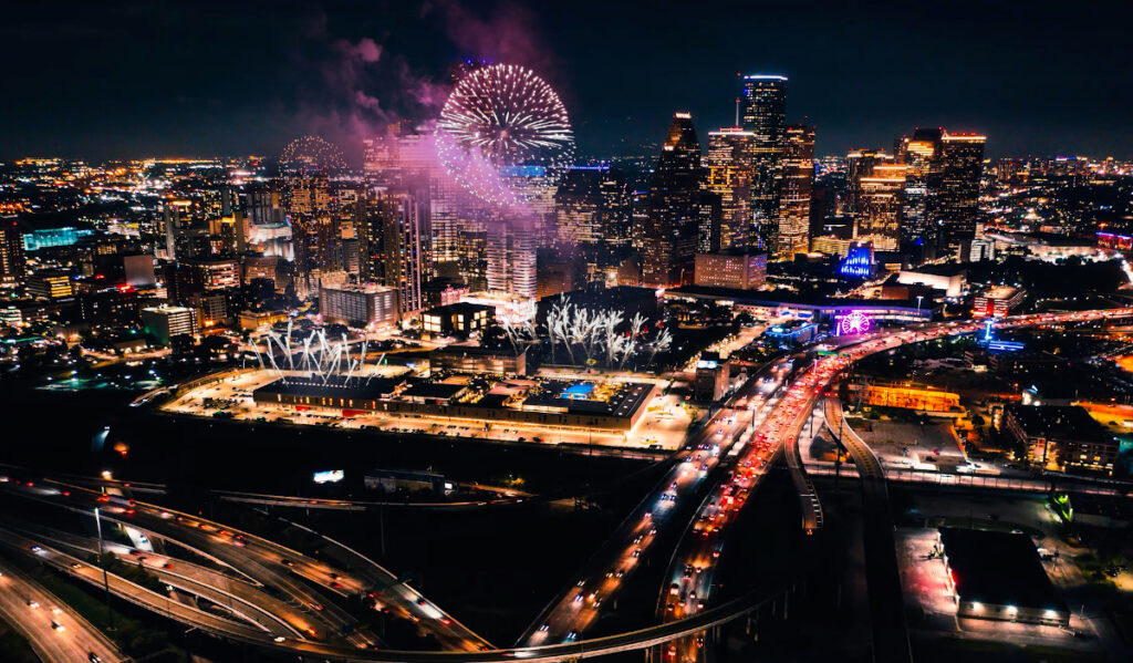 Fireworks exploding over the Downtown Houston skyline