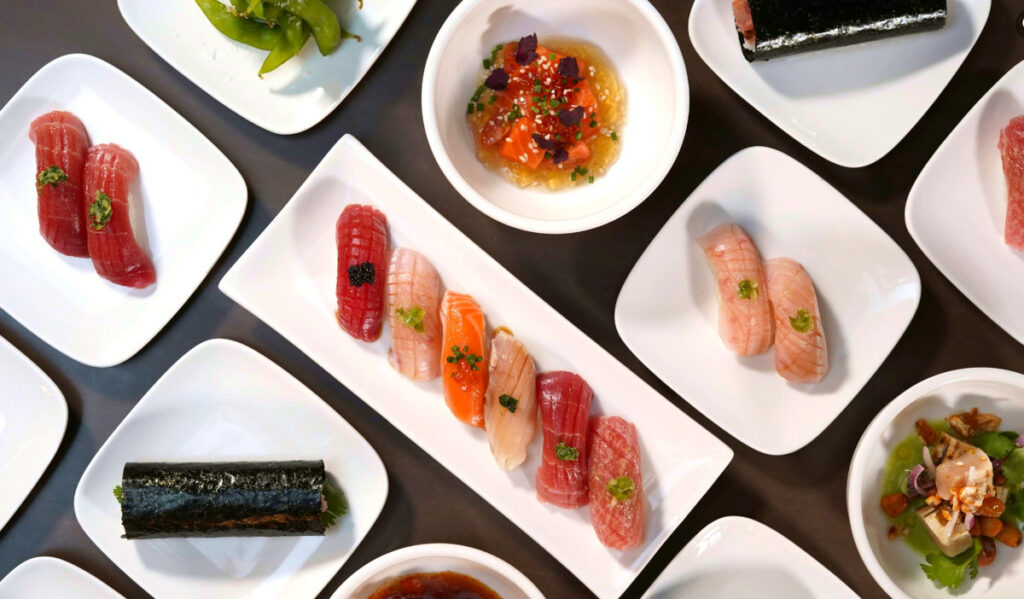 An overhead view of several sushi dishes