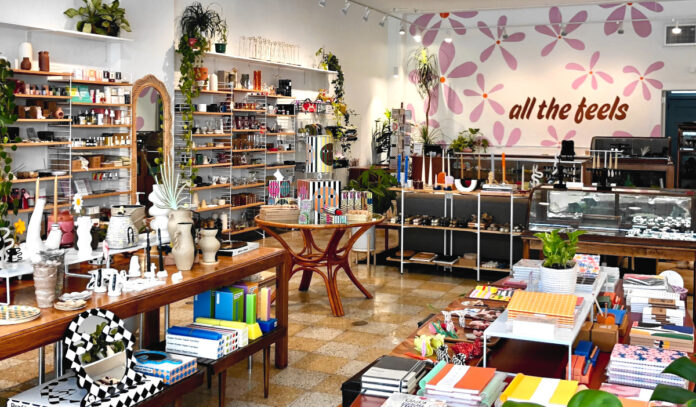 Interior of a shop with tables and shelves filled with products