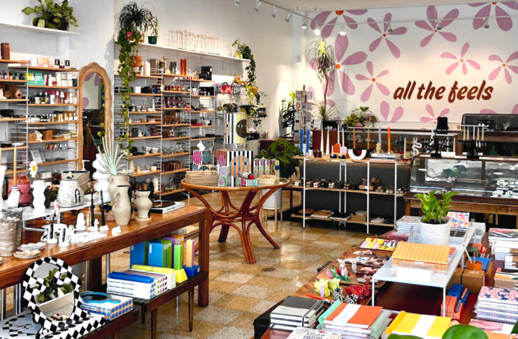 Interior of a shop with tables and shelves filled with products