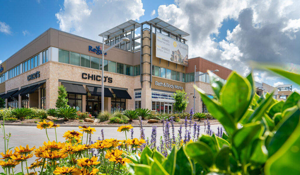 Exterior of Pearland Town Center with the names of shops visible