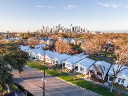 An aerial view of Project Row Houses with the Downtown skyline in the background