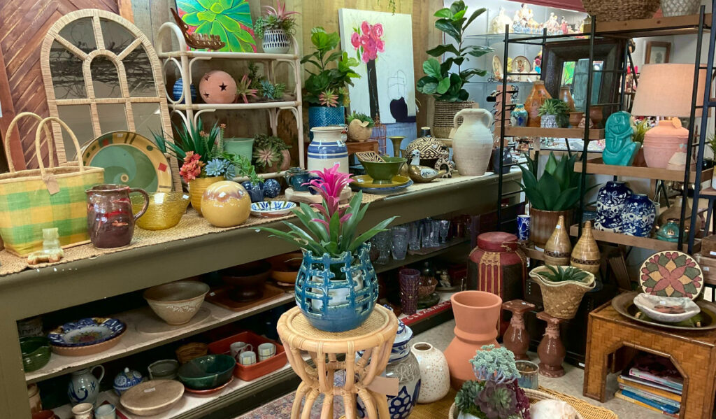 An antique stall with colored plant pots