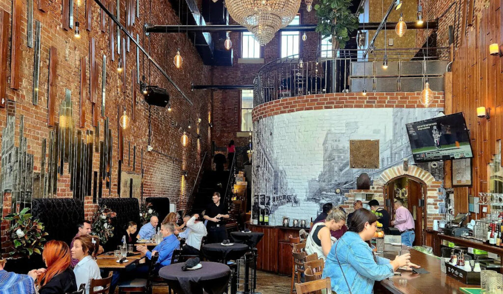 Interior of Hearsay in daytime with people at tables and the bar