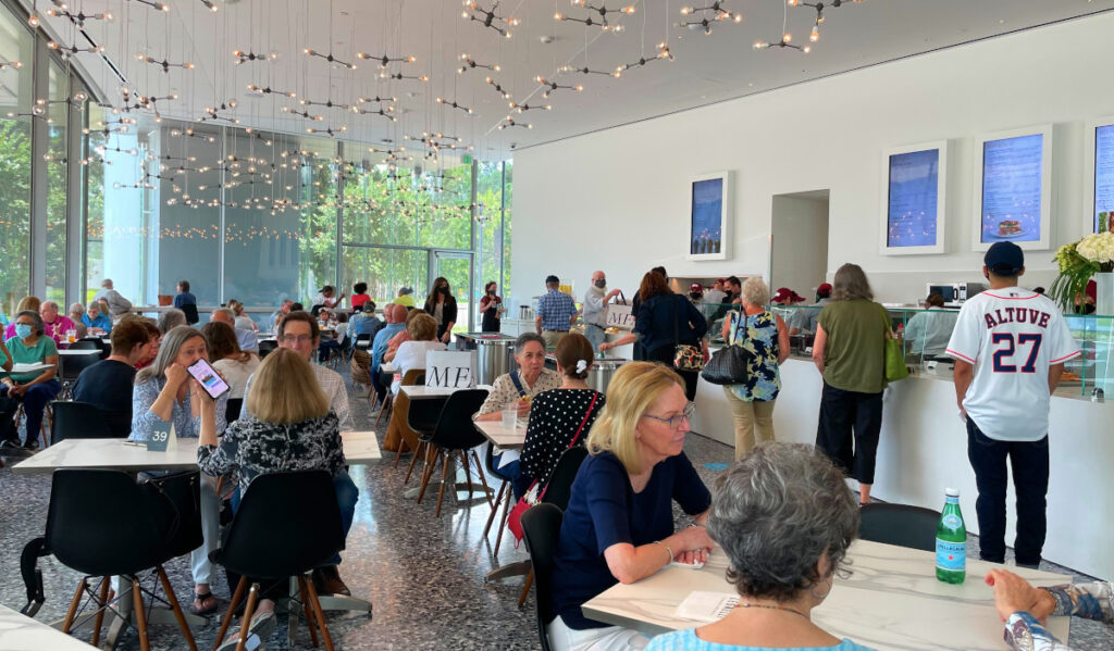 Interior of Cafe Leonelli with people in line and sitting at tables