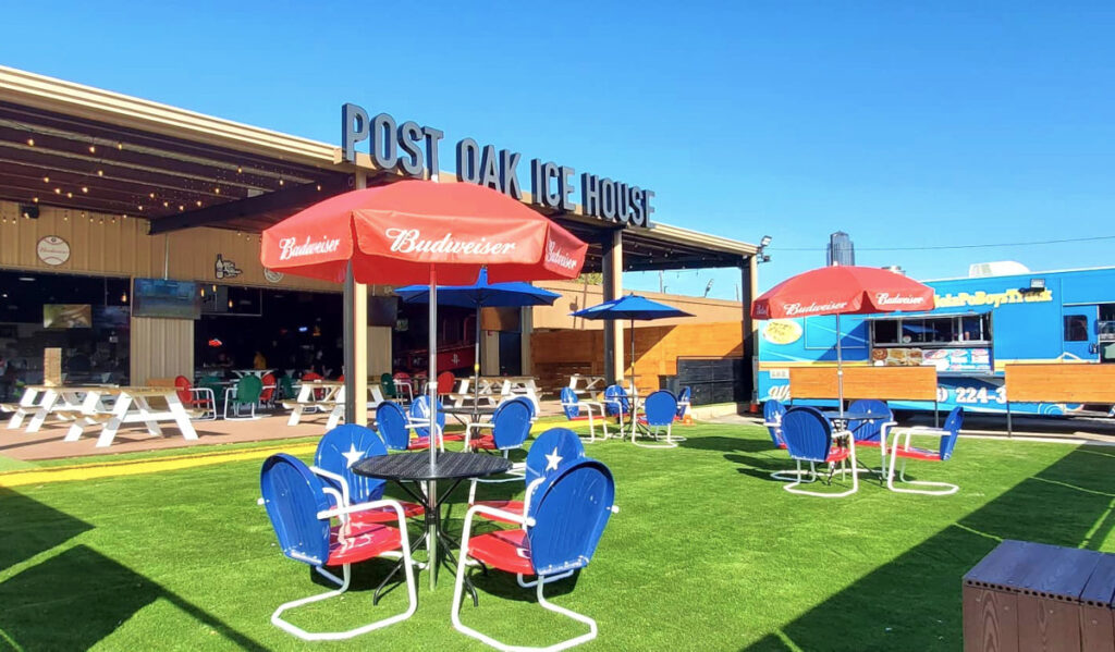 An outdoor patio on green turf on a sunny day