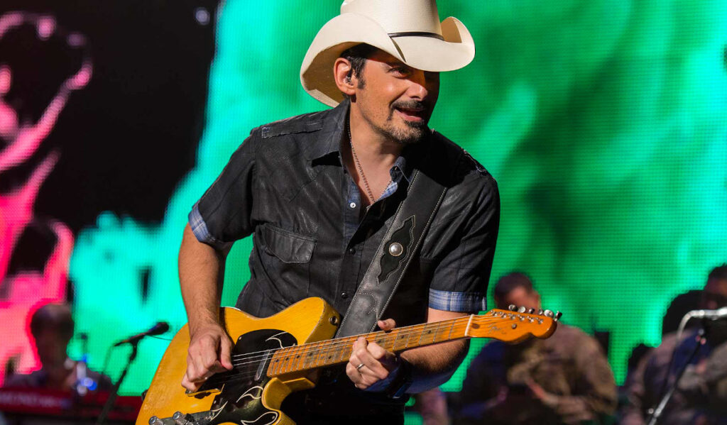 Brad Paisley playing guitar on stage