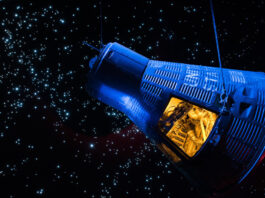 A exhibit display of a Gemini capsule floating in space