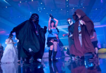 Plan Your 5-Day Memorial Day Weekend: May 21 to 25, 2026 Fans cosplaying as Lara Croft and Star Wars characters dance in a blue-lit room