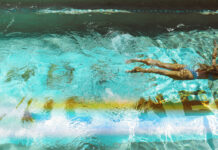 Take a dip with 18 day passes to hotel & resort pools around Greater Houston A woman swimming through a pool with a wake behind her