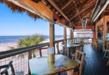 Where to Happy Hour in Galveston A balcony bar with views of the Galveston shore