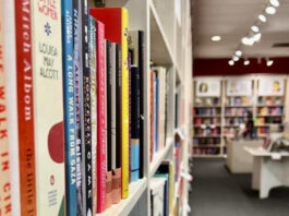 A close up of a book shelf in a book store