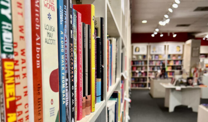 A close up of a book shelf in a book store