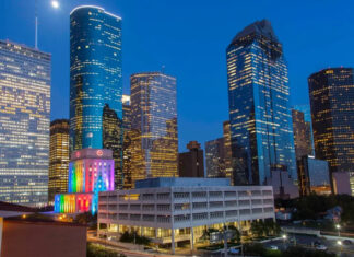 20+ Things to Do for Pride Month 2026 in Houston A Downtown Houston skyline with rainbow colors projected on City Hall