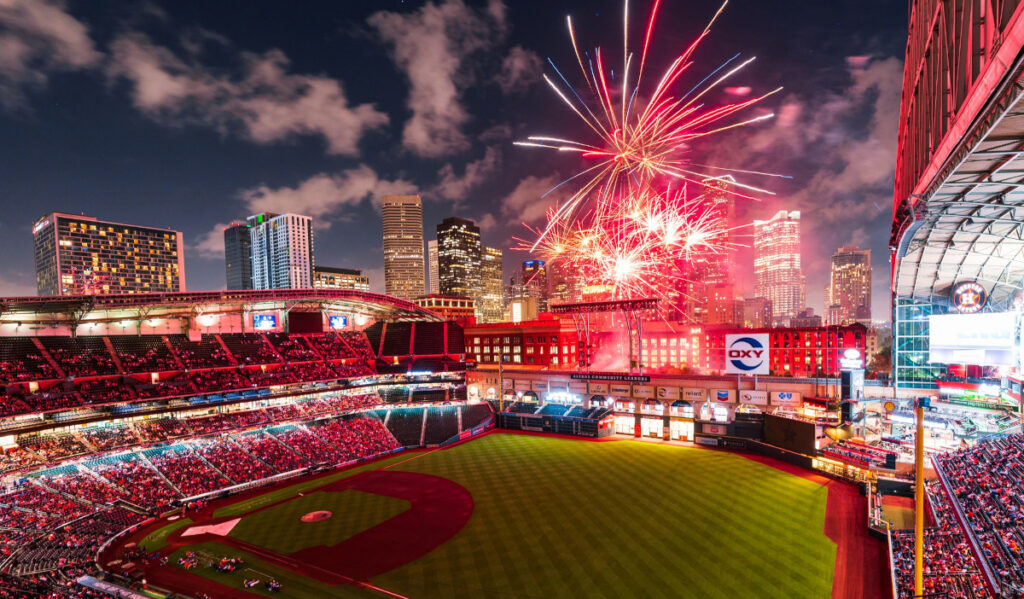 Red fireworks explode above an open Minute Maid Park